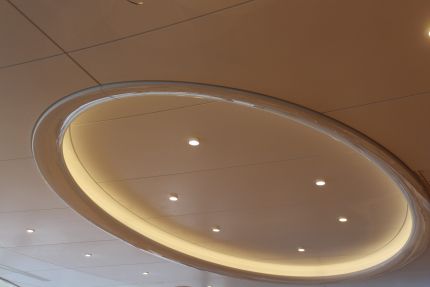 Round ceiling lighting with additional spotlights in the center